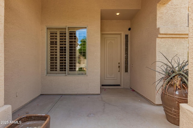 22322 N 77th St, Scottsdale, AZ 85255 - view of exterior entry featuring stucco siding and a patio