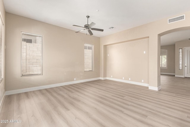 22322 N 77th St, Scottsdale, AZ 85255 - spare room with ceiling fan, arched walkways, light wood finished floors, and baseboards