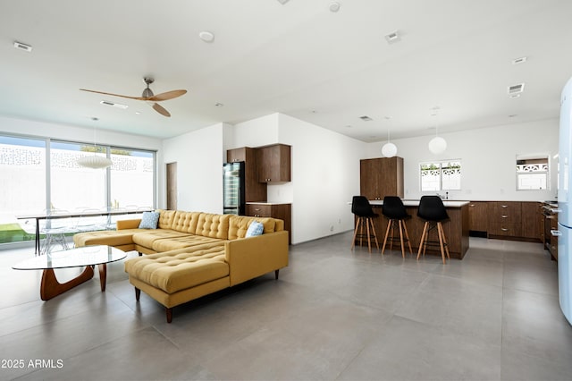7646 E Catalina Dr, Scottsdale, AZ 85251 - living area featuring a ceiling fan, concrete flooring, and visible vents