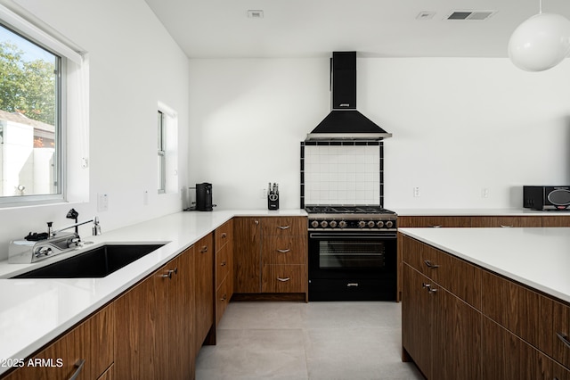 7646 E Catalina Dr, Scottsdale, AZ 85251 - kitchen featuring a sink, ventilation hood, light countertops, visible vents, and black appliances