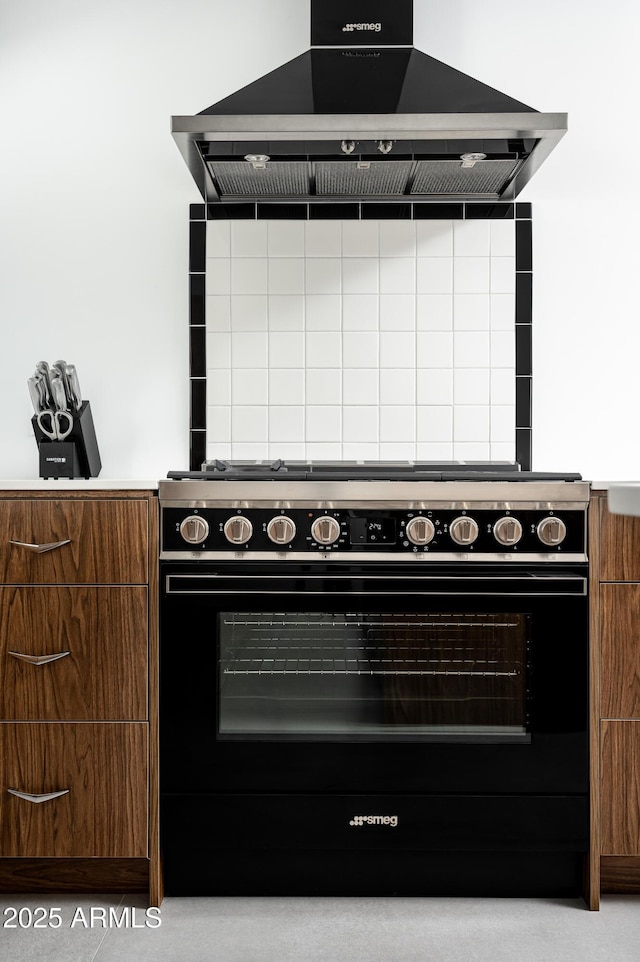 7646 E Catalina Dr, Scottsdale, AZ 85251 - interior details featuring black / electric stove and wall chimney range hood