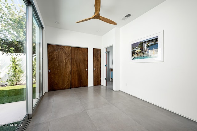 7646 E Catalina Dr, Scottsdale, AZ 85251 - unfurnished bedroom featuring ceiling fan, concrete floors, and visible vents