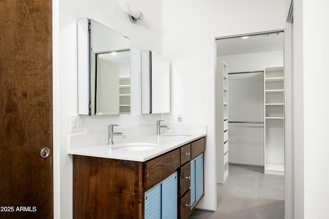 7646 E Catalina Dr, Scottsdale, AZ 85251 - full bathroom with double vanity, a walk in closet, and a sink