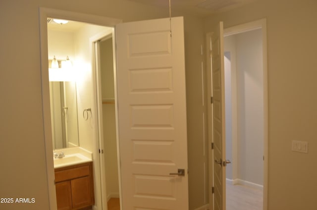 bathroom with vanity and baseboards