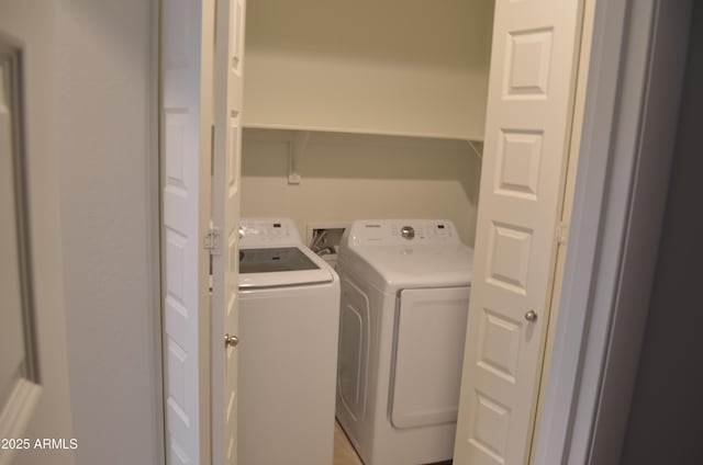 laundry area with laundry area and separate washer and dryer