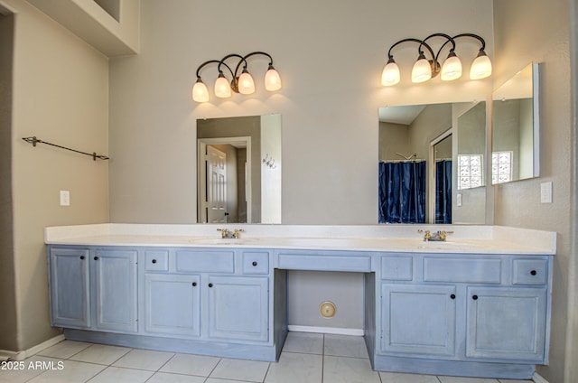 full bathroom with double vanity, tile patterned flooring, a shower with curtain, and a sink