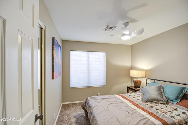 carpeted bedroom with visible vents, baseboards, and ceiling fan