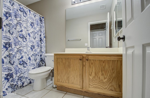 bathroom featuring tile patterned flooring, visible vents, toilet, and vanity