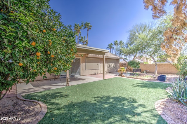 view of yard featuring a patio area and fence