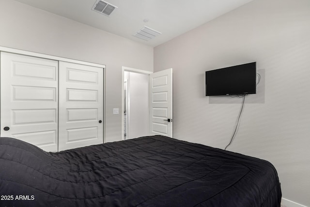 bedroom featuring a closet and visible vents