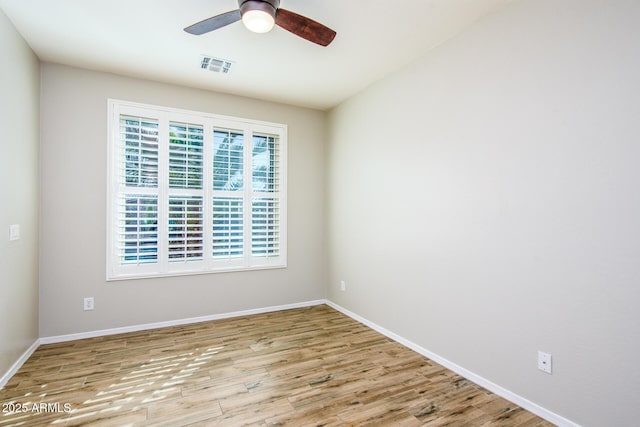 42531 W Heavenly Pl, Maricopa, AZ 85138 - unfurnished room featuring baseboards, visible vents, ceiling fan, and wood finished floors