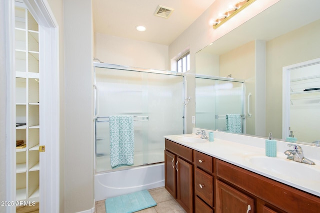 42531 W Heavenly Pl, Maricopa, AZ 85138 - bathroom featuring double vanity, tile patterned flooring, visible vents, and a sink