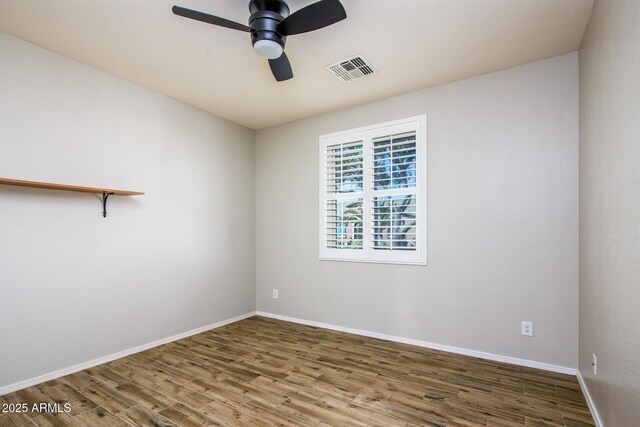 42531 W Heavenly Pl, Maricopa, AZ 85138 - empty room with visible vents, ceiling fan, baseboards, and wood finished floors