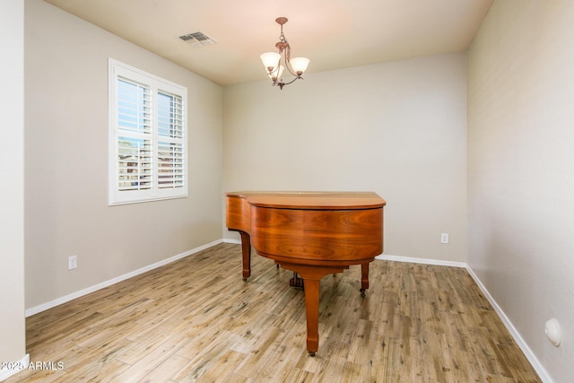 42531 W Heavenly Pl, Maricopa, AZ 85138 - sitting room featuring a chandelier, wood finished floors, visible vents, and baseboards