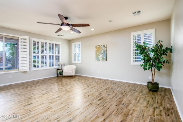 42531 W Heavenly Pl, Maricopa, AZ 85138 - living area featuring recessed lighting, wood finished floors, a ceiling fan, visible vents, and baseboards