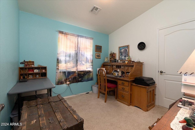 carpeted office featuring vaulted ceiling