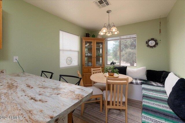 dining area featuring a notable chandelier