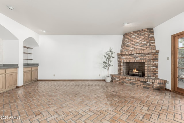 unfurnished living room with a fireplace