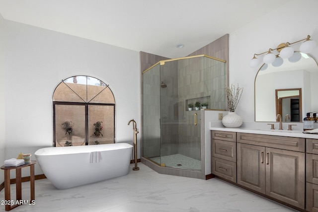 bathroom featuring shower with separate bathtub and vanity