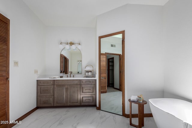 bathroom with vanity and a bathtub