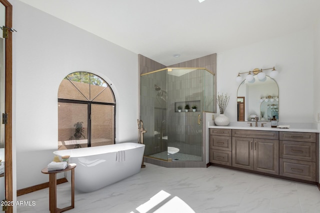 bathroom featuring vanity and separate shower and tub