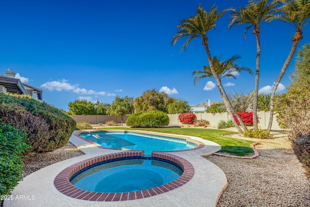 view of swimming pool with an in ground hot tub