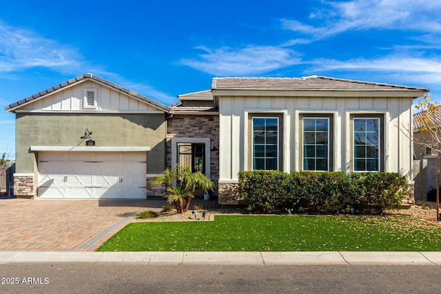 view of front of home with a garage and a front yard