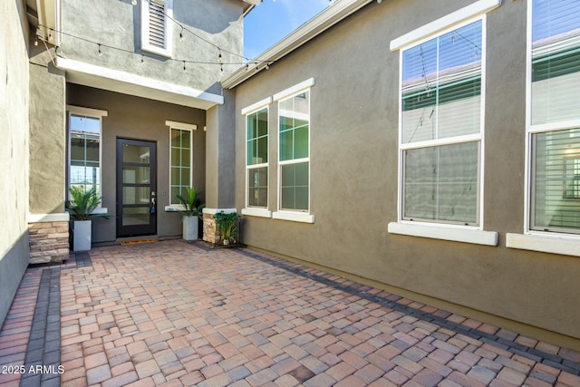 doorway to property with a patio