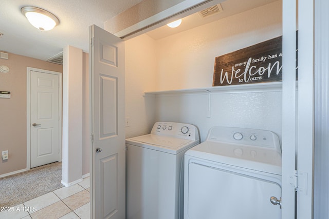 9820 N Central Ave Unit 212, Phoenix, AZ 85020 - laundry room featuring separate washer and dryer and light tile patterned floors