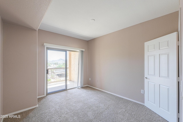 9820 N Central Ave Unit 212, Phoenix, AZ 85020 - empty room featuring carpet flooring and baseboards