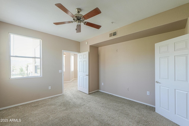 9820 N Central Ave Unit 212, Phoenix, AZ 85020 - unfurnished bedroom with light colored carpet and ceiling fan