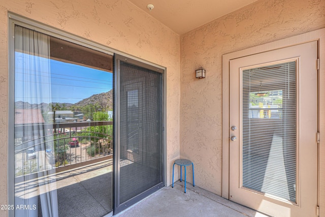9820 N Central Ave Unit 212, Phoenix, AZ 85020 - doorway to property with stucco siding, a balcony, and a mountain view