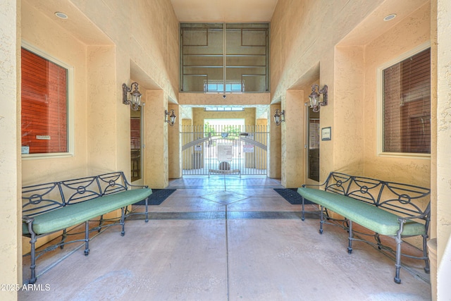 9820 N Central Ave Unit 212, Phoenix, AZ 85020 - hall with concrete flooring and a high ceiling