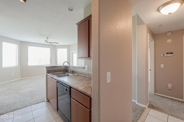 9820 N Central Ave Unit 212, Phoenix, AZ 85020 - kitchen with black dishwasher, light colored carpet, light tile patterned floors, a ceiling fan, and open floor plan