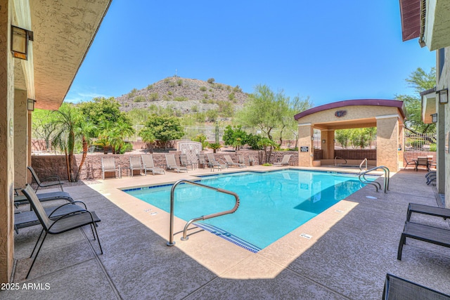 9820 N Central Ave Unit 212, Phoenix, AZ 85020 - community pool featuring a mountain view and a patio area