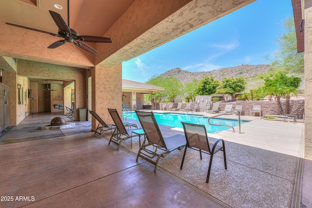 9820 N Central Ave Unit 212, Phoenix, AZ 85020 - community pool featuring a mountain view, a ceiling fan, and a patio