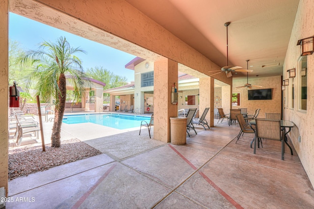 9820 N Central Ave Unit 212, Phoenix, AZ 85020 - community pool featuring a patio, a ceiling fan, and outdoor dining area