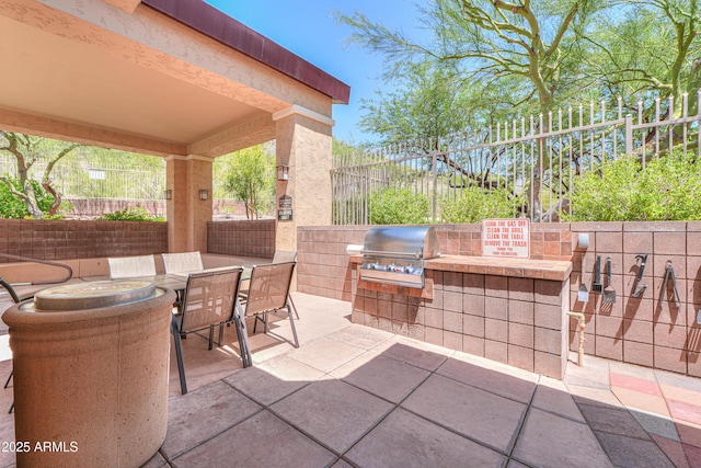 9820 N Central Ave Unit 212, Phoenix, AZ 85020 - fenced backyard featuring an outdoor kitchen, a patio, and outdoor dining space