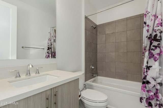 bathroom with shower / tub combo, vanity, and toilet