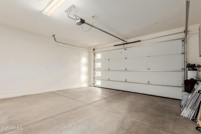 garage featuring baseboards and a garage door opener