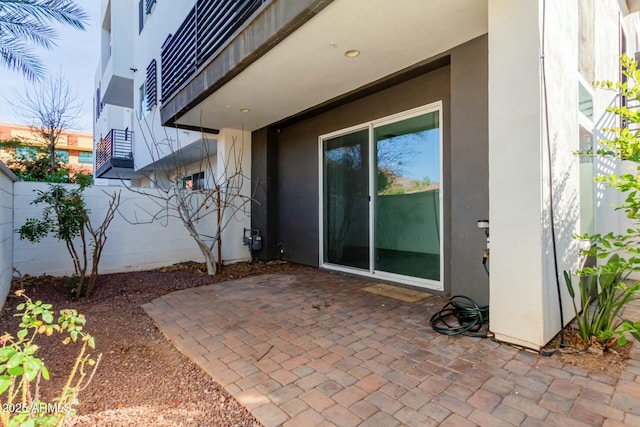 view of patio / terrace featuring fence