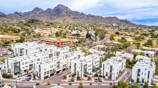 birds eye view of property with a mountain view