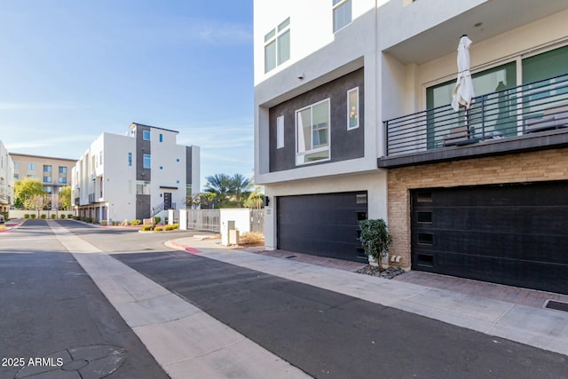 view of road with sidewalks and a residential view