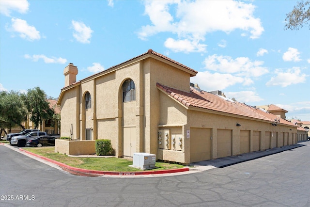 view of property featuring community garages