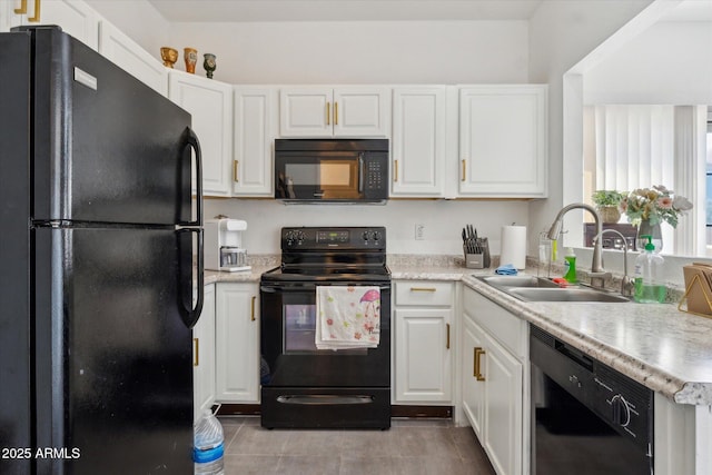 kitchen with white cabinetry, a sink, and black appliances
