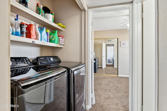 laundry room with laundry area, visible vents, washing machine and dryer, and carpet