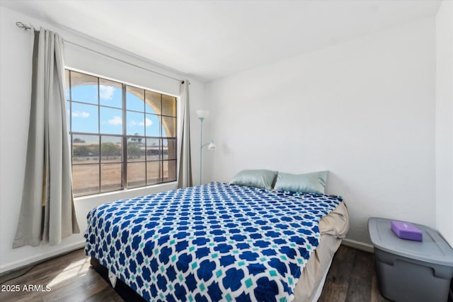 bedroom with wood finished floors