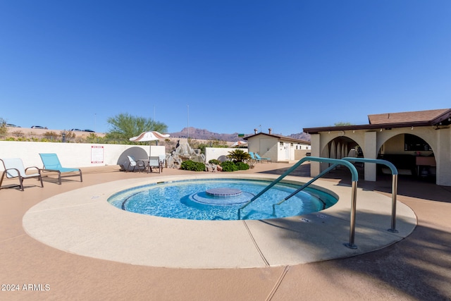 view of swimming pool with a patio