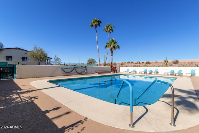 view of swimming pool with a patio area