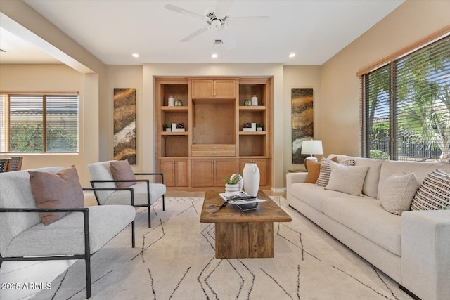 12820 W La Vina Dr, Sun City West, AZ 85375 - living room with a ceiling fan, built in features, and recessed lighting